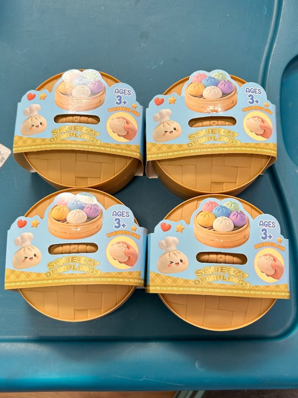 Lot of 4 Squeezy Dumplings Fidget Squishy Toys Steamer Basket Sealed